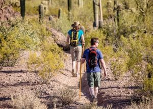 man hiking with his wife